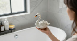 She Used A Ceramic Swan To Hide This Major Bathroom Eyesore